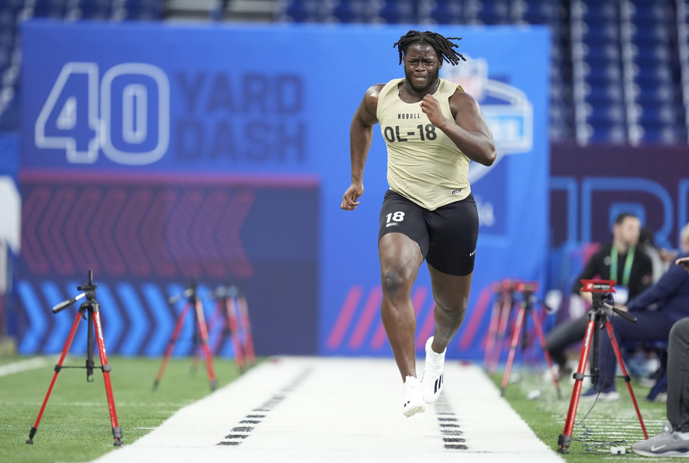 New York Jets offensive lineman Olu Fashanu runs the 40-yard dash during the 2024 NFL Scouting Combine in Indianapolis. (AP/Michael Conroy)