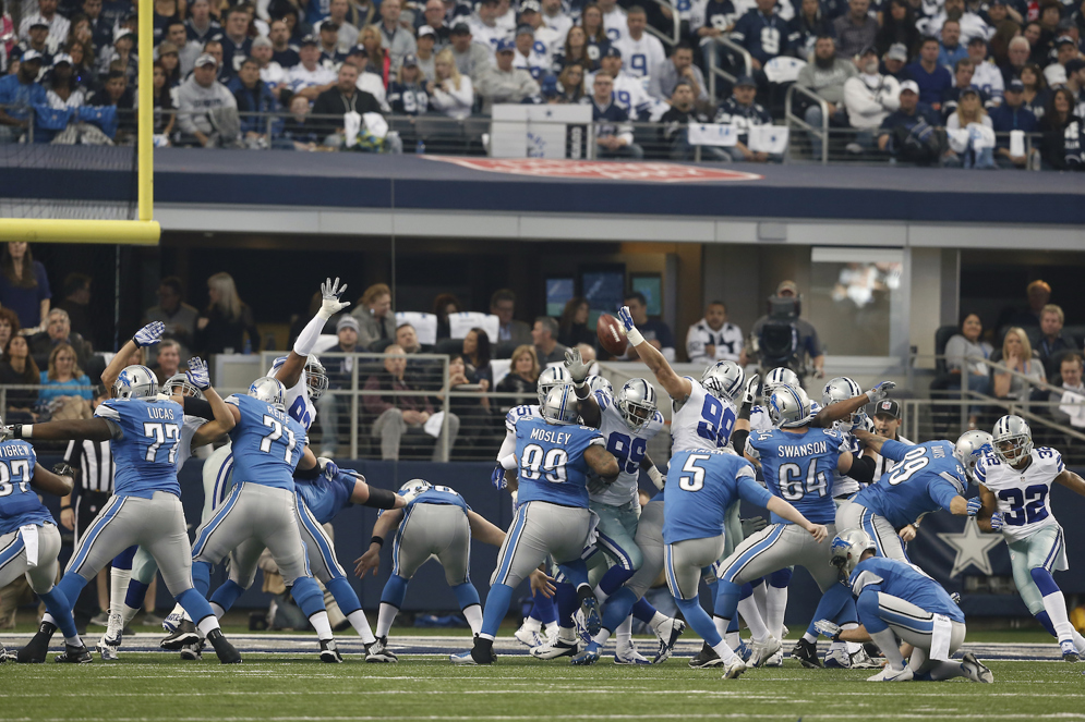 Detroit Lions kicker Matt Prater kicks an extra point after a touchdown against Dallas in the Wild Card Round of the 2014 NFL playoffs. (AP Photo/Brandon Wade)