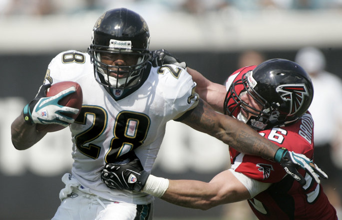 Former Jacksonville Jaguars running back Fred Taylor runs with the football.