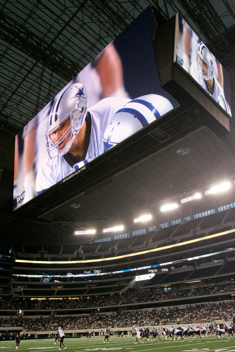 The Dallas Cowboys’ high-definition video board is an example of how teams use technology to enhance the game experience. The screen is the equivalent of more than 4,900 52-inch flat-panel TVs.&#160;(AP Photo/Tony Gutierrez)