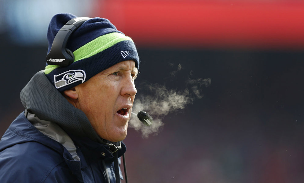 Seattle Seahawks coach Pete Carroll stays connected to his team thanks to the NFL&#39;s Event Frequency Coordinators. (AP Photo/Aaron M. Sprecher)