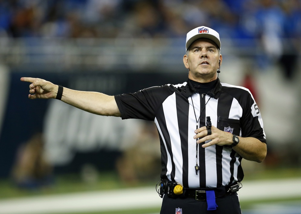 NFL Referee Bill Vinovich makes a call during an NFL football game between the Detroit Lions and the Chicago Bears on Thursday, Nov. 27, 2014 in Detroit. (Jeff Haynes/AP Images for Panini)