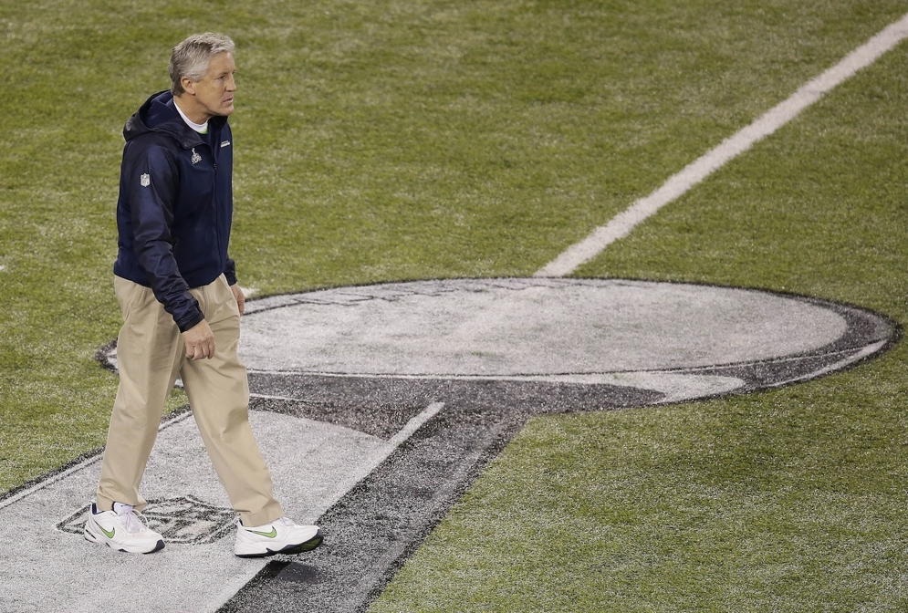 Seattle Seahawks head coach Pete Carroll walks on the field before&#160;Super Bowl XLVIII&#160;against the Denver Broncos. Hard work and a break from Mother Nature helped Game Operations staff get the&#160;MetLife Stadium&#160;field ready for the game.&#160; (AP Photo/Charlie Riedel)