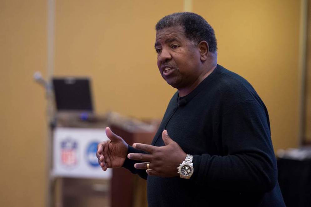 Former Vikings head coach Dennis Green stresses the value of football to 2015 NFL-NCAA Coaches Academy attendees.