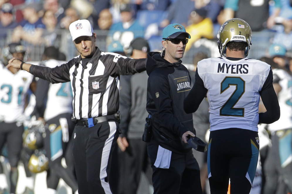 Jacksonville Jaguars kicker Jason Myers walks to the bench after missing an extra point in the second half of a game against the Tennessee Titans. (AP Photo/James Kenney)