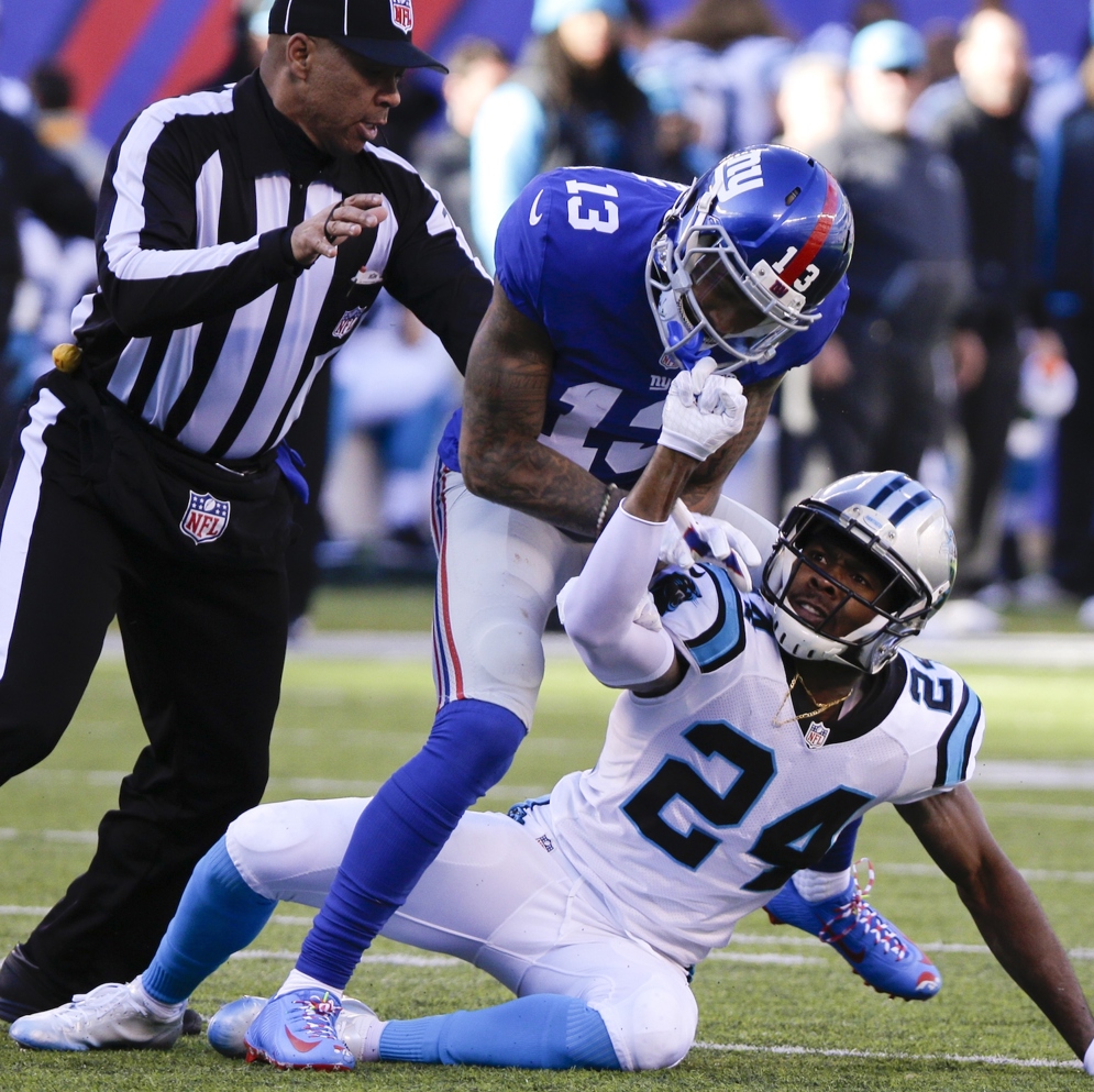 Carolina Panthers cornerback Josh Norman and New York Giants wide receiver Odell Beckham, Jr. square off in a week 15 game during the 2022 NFL season. Norman was fined $26,044 for personal foul penalties and Beckham, Jr. was suspended for one game. (Evan Pinkus via AP)