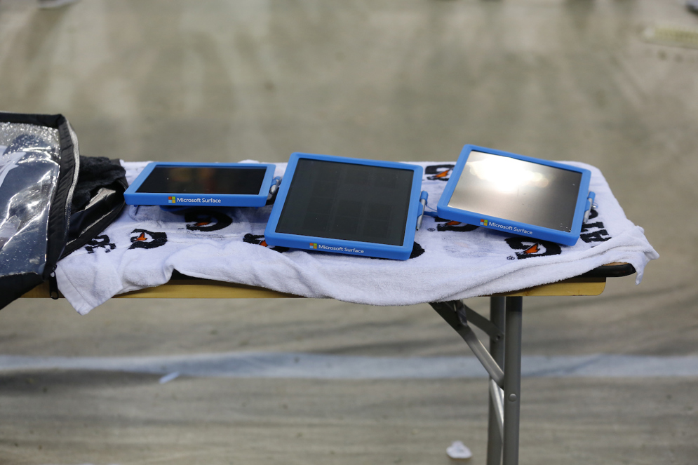 A trio of Microsoft Surface tablets are seen on a sideline during an NFL football game.  (AP Photo/Ryan Kang) 