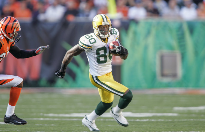 Former Green Bay Packers wide receiver Donald Driver runs with the football.