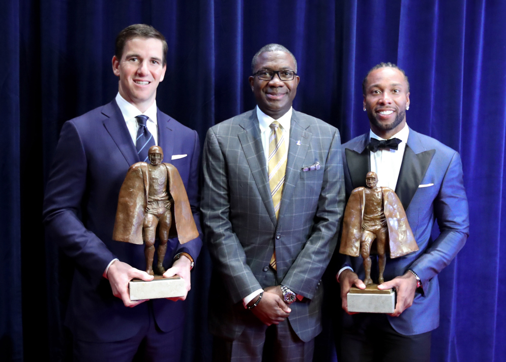 Giants quarterback Eli Manning and Cardinals wide receiver Larry Fitzgerald received the Walter Payton Man of the Year Award at the 6th annual NFL Honors in Houston ahead of Super Bowl LI. (Ben Liebenberg via AP)