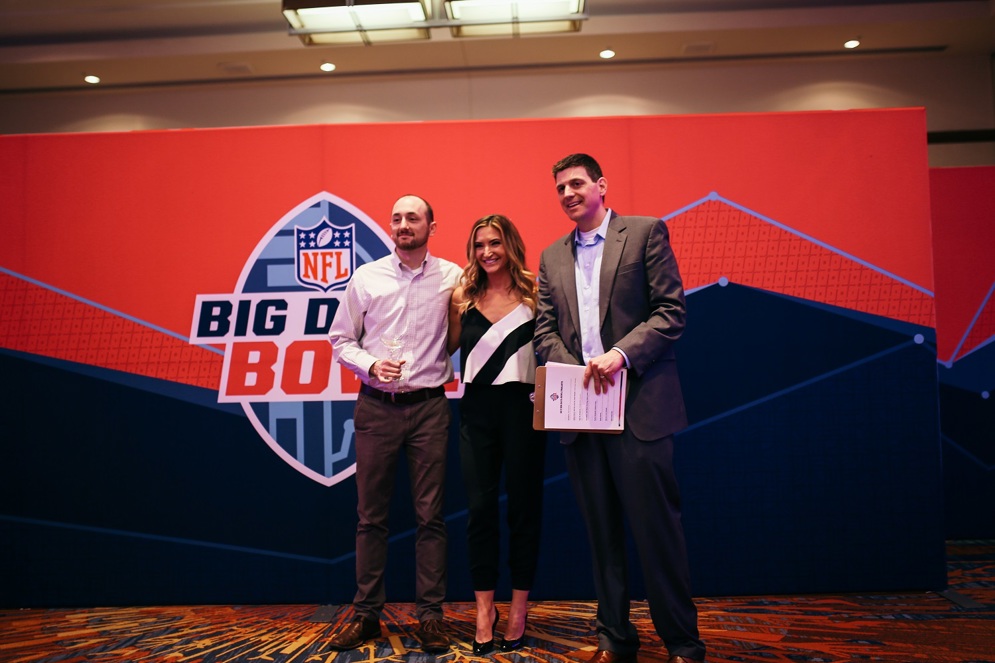 Open entry winner Nathan Sterken with emcee Cynthia Frelund and Mike Lopez, the NFL&#39;s Director of Football Data and Analytics