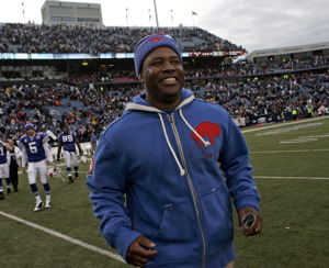 A Buffalo Bills coach walks to the sidelines during a game.