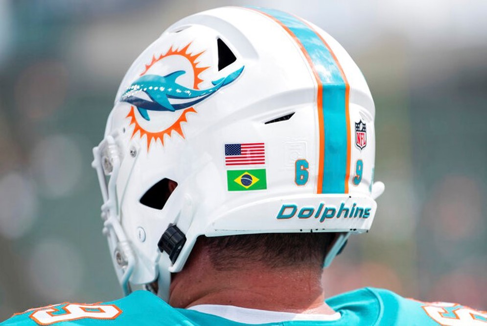 In 2021, IPP participants and alumni had the option of sporting a helmet decal featuring the flag of their home countries during the preseason. During the 2021 preseason, there were 14 IPP participants on 11 teams, hailing from Austria, Australia, Brazil, Chile, Germany, Italy, Mexico, and the United Kingdom. (AP/Zach Bolinger)