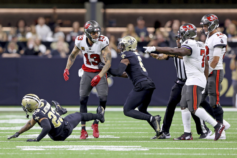 Tampa Bay Buccaneers wide receiver Mike Evans and New Orleans Saints cornerback Marshon Lattimore square off in a Week 2 game during the 2022 season. Evans was fined $62,222 for the personal foul penalties and was suspended for one game. (AP/Michael DeMocker)