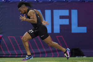 Bijan Robinson runs the 40-yard dash at the NFL scouting combine in 2023.